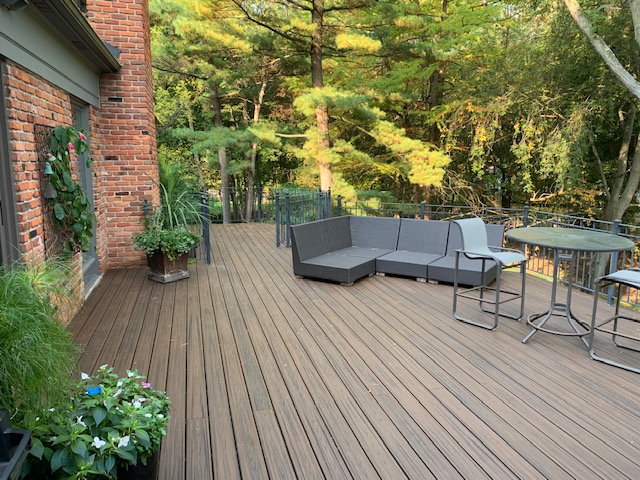 Custom deck with patio furniture and entertaining space