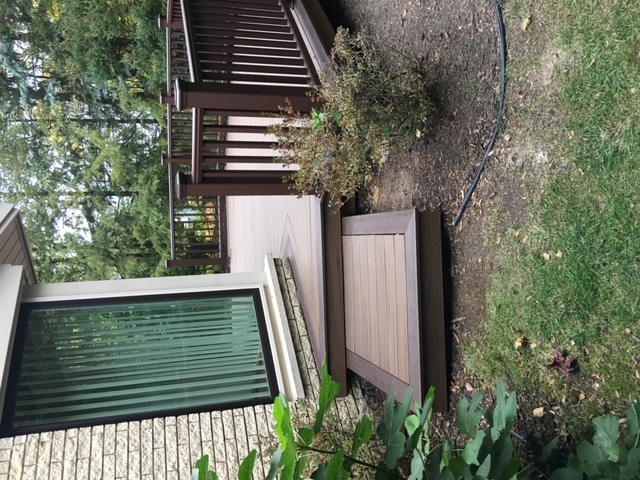 Walk-out surface level deck with custom railings