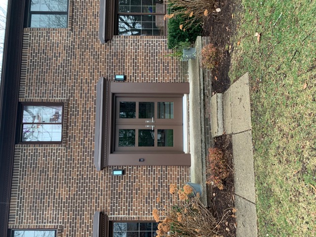 Elegant entry door installation in dark stain finish