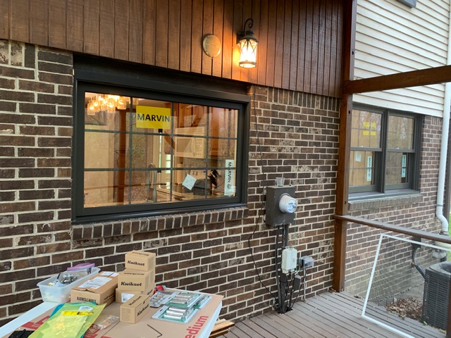 Architectural window installation with black frames
